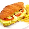 Avocado goat cheese spread with egg croissant vegetarian sandwich 