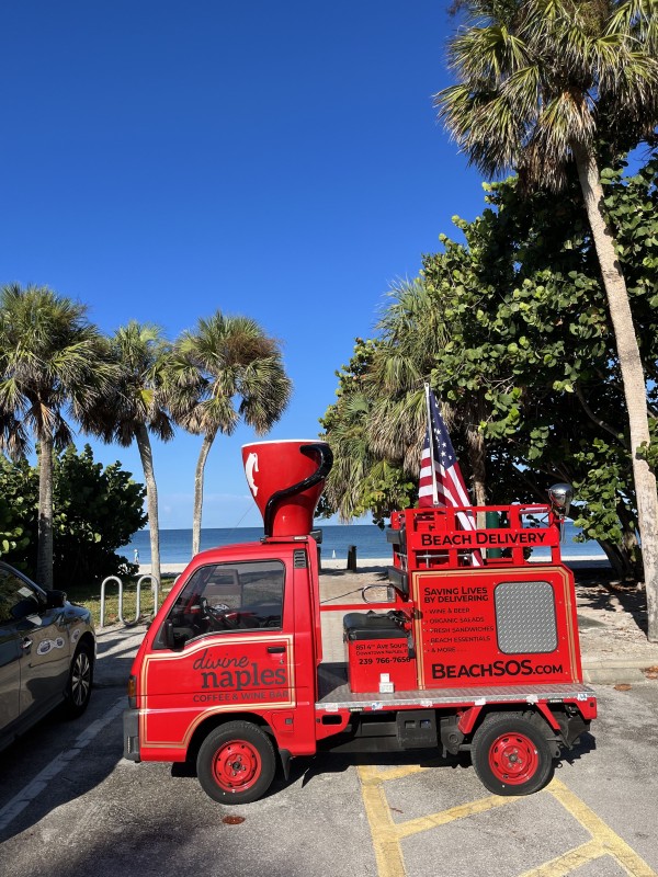 Small red Fire Truck deliver Food and Drinks to Naples beach