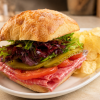 Chipotle Harte-On salami sandwich on ciabatta with kettle chips for fast beach food delivery in Naples Florida