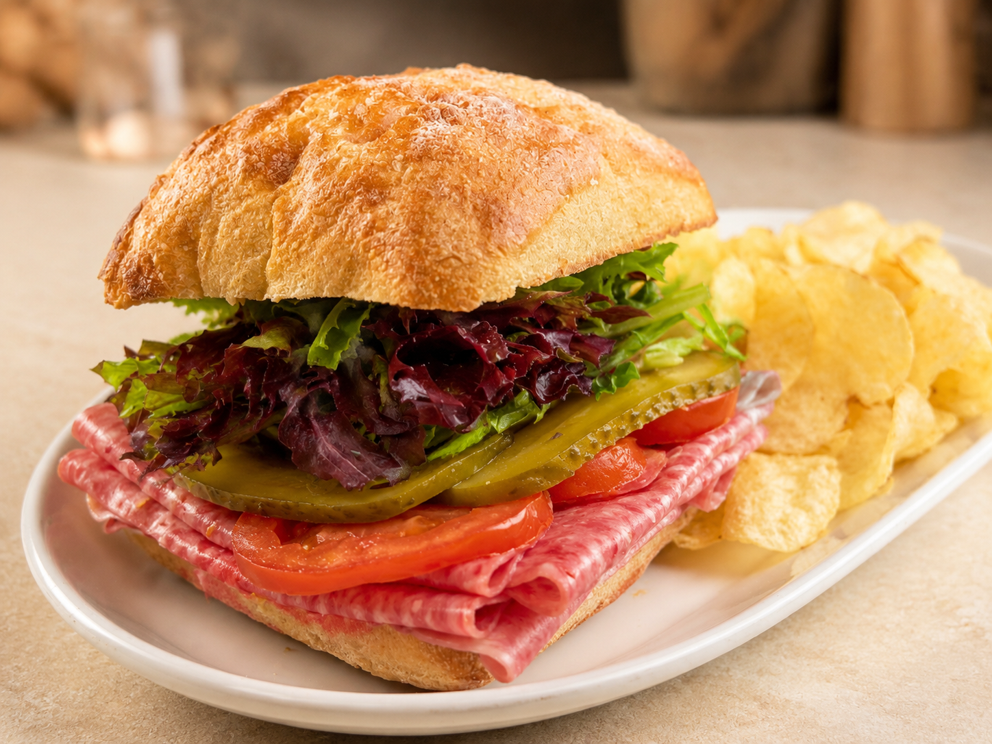 Chipotle Harte-On salami sandwich on ciabatta with kettle chips for fast beach food delivery in Naples Florida