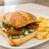 Blue Cheese Veggie sandwich on ciabatta with kettle chips for fast beach food delivery in Naples Florida