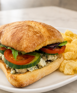 Blue Cheese Veggie sandwich on ciabatta with kettle chips for fast beach food delivery in Naples Florida