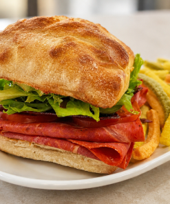 Piccanti Amichetto Italian salami sandwich on ciabatta with kettle chips for fast beach food delivery in Naples Florida