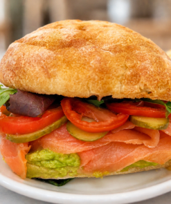 Salmon Explorer smoked salmon and avocado sandwich on ciabatta with kettle chips for fast beach food delivery in Naples Florida