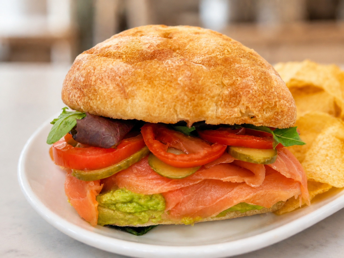 Salmon Explorer smoked salmon and avocado sandwich on ciabatta with kettle chips for fast beach food delivery in Naples Florida
