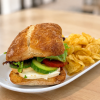 Vegging Out On A Bun caprese and mozzarella sandwich on ciabatta with kettle chips for fast beach food delivery in Naples Florida