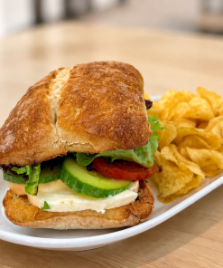 Vegging Out On A Bun caprese and mozzarella sandwich on ciabatta with kettle chips for fast beach food delivery in Naples Florida